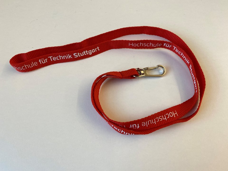 Ein Lanyard mit HFT Logo