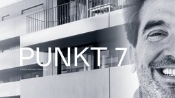 Portrait und Gebäude auf Plakat